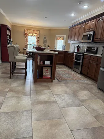 a kitchen with stainless steel appliances granite countertop a sink and cabinets