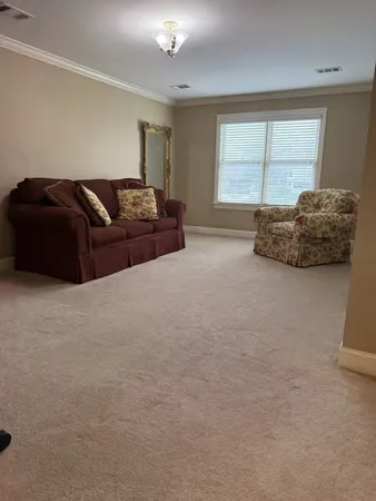a living room with a couch and a large window