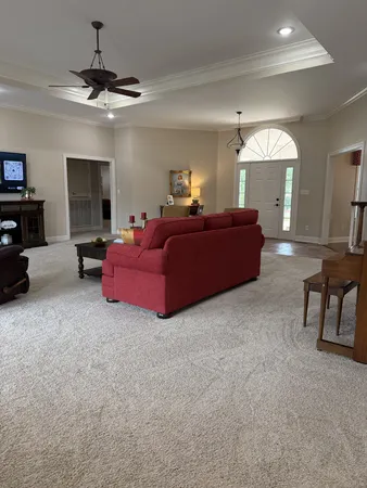 a living room with furniture and a fireplace