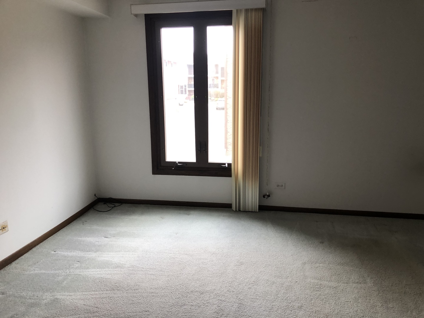 11277 South Roberts Road, Unit E Palos Hills, IL 60465 - Photo 18 of 27 an empty room with a window