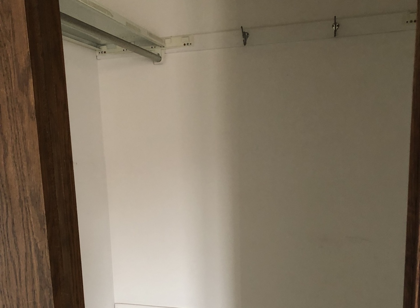 11277 South Roberts Road, Unit E Palos Hills, IL 60465 - Photo 19 of 27 a view of a rack on the wall