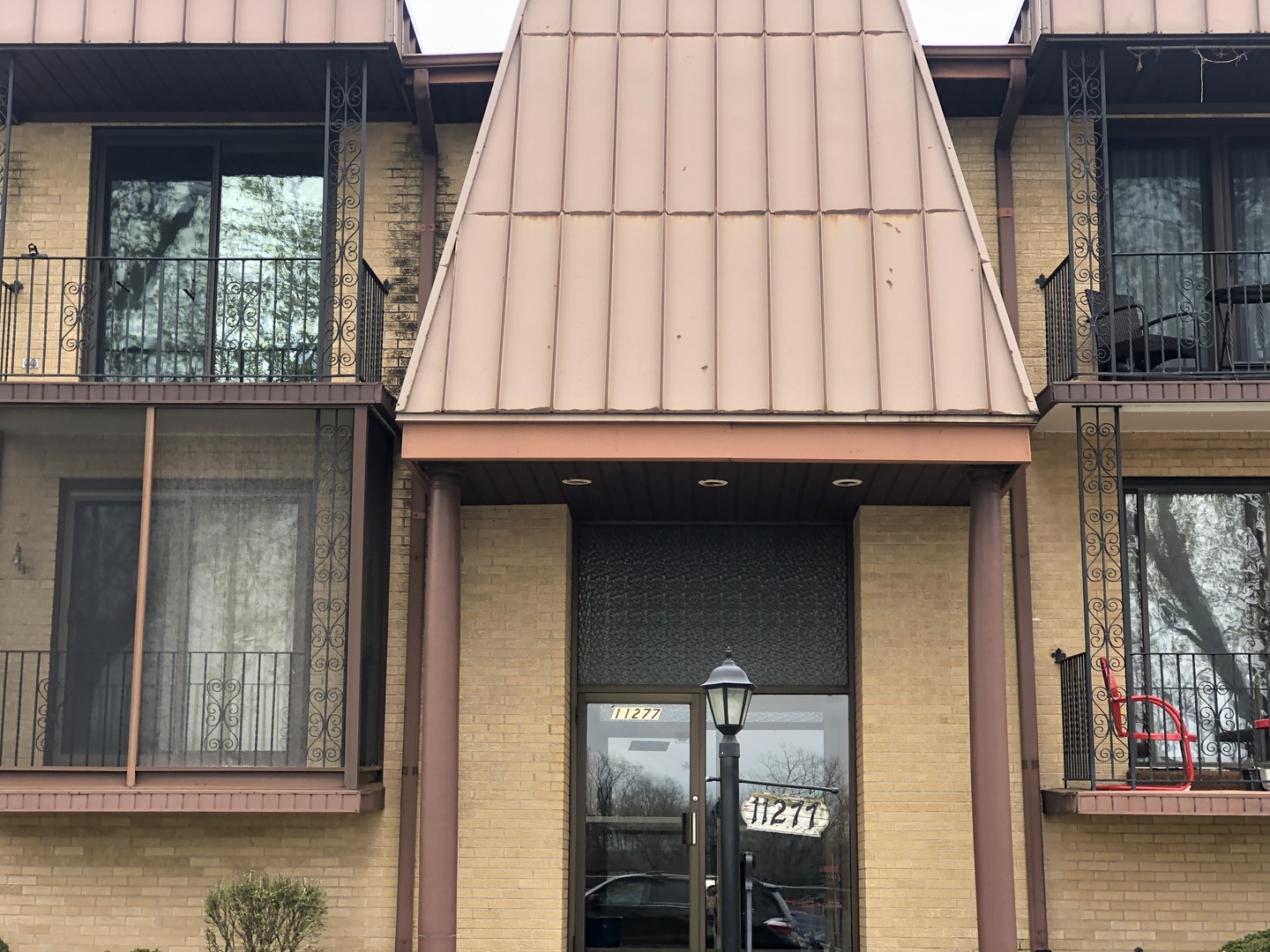 11277 South Roberts Road, Unit E Palos Hills, IL 60465 - Photo 3 of 27 a view of a house with a door and wooden floor