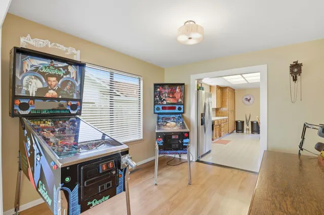 a view of a livingroom with furniture wooden floor and window