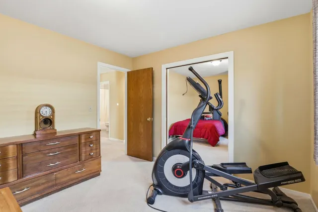 a bedroom with a bed and cabinets