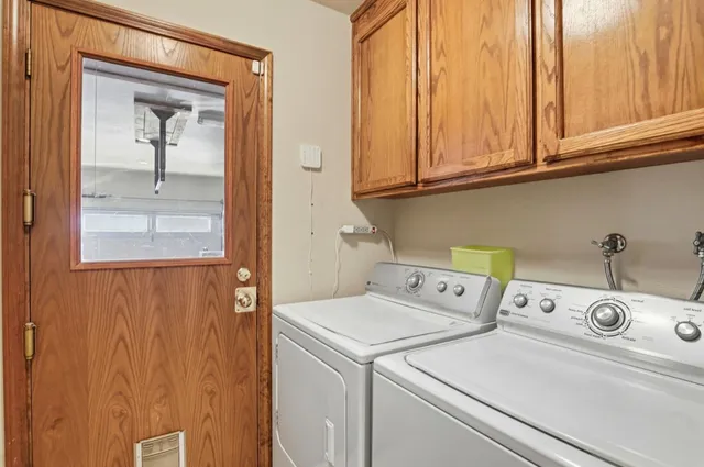 a utility room with dryer and washer