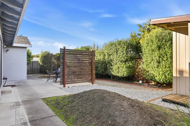 a view of a porch with a bench in patio