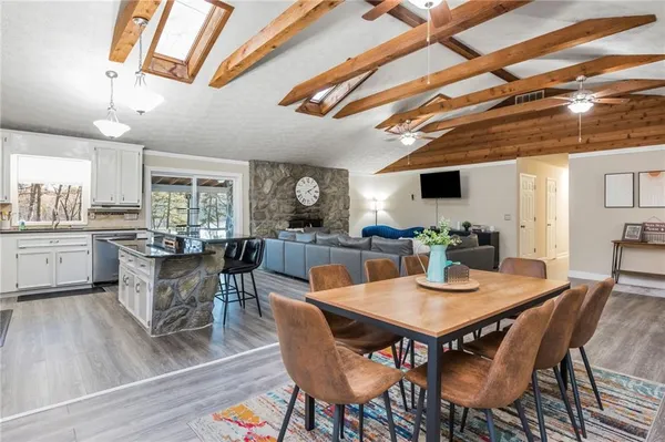 a kitchen with stainless steel appliances granite countertop a stove and cabinets