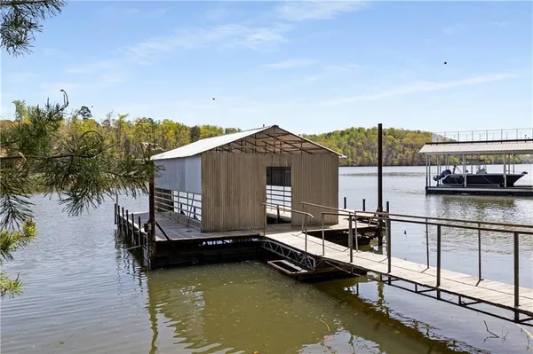 an aerial view of a houses with a lake view