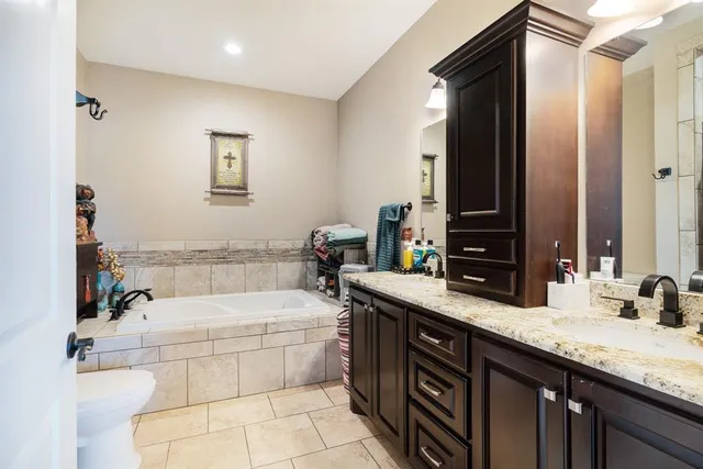 a bedroom with a bed and a chair