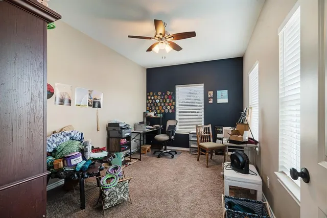 a view of a backyard with wooden stairs and a large tree