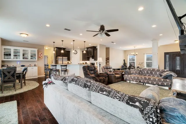 a living room with furniture fireplace and a flat screen tv