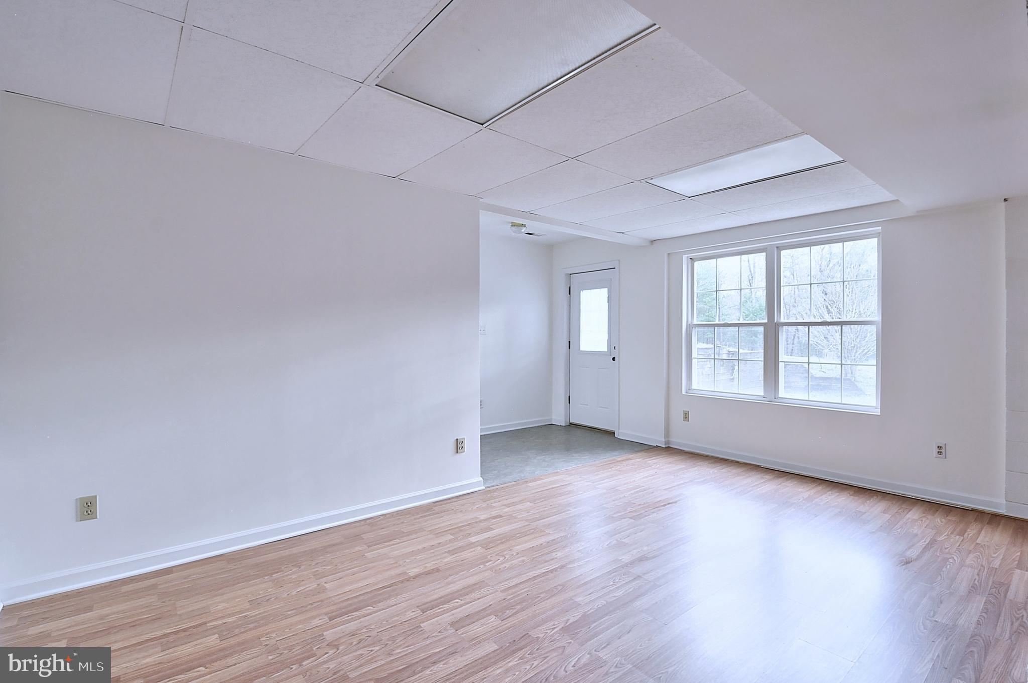 235 Peppermint Spring Lane Winchester, VA 22603 - Photo 33 of 90 an empty room with wooden floor and windows