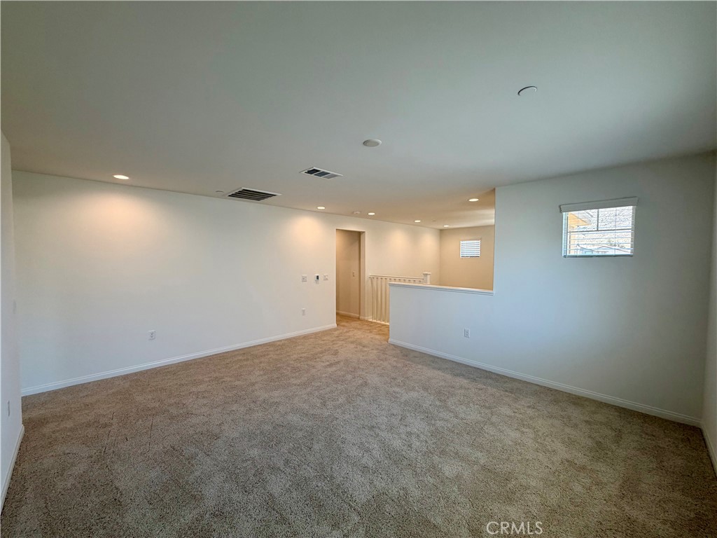 21624 Thomas Court Riverside, CA 92507 - Photo 17 of 36 an empty room with windows