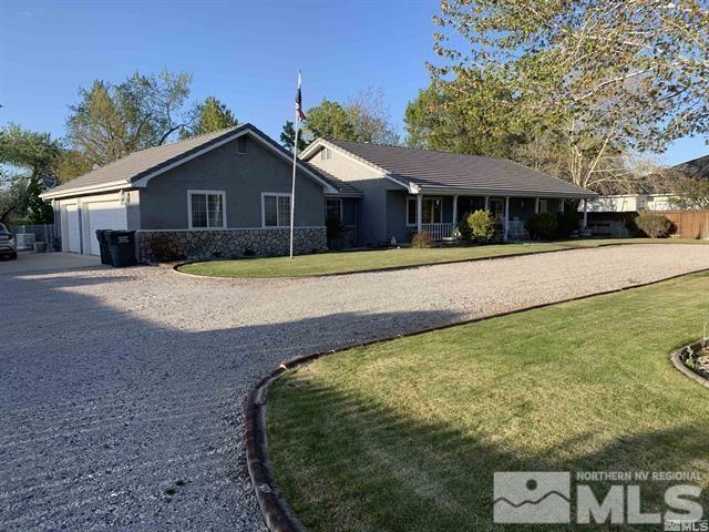5076 Rivers Edge Drive Fallon, NV 89406 - Photo 3 of 34 a front view of a house with a yard