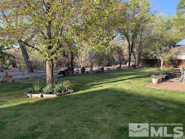5076 Rivers Edge Drive Fallon, NV 89406 - Photo 8 of 34 a swimming pool with lots of trees and plants