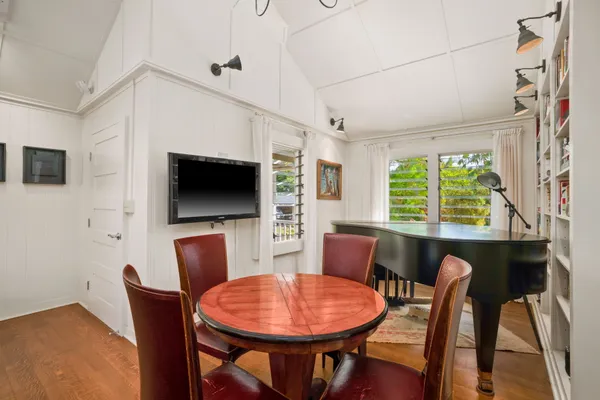 a kitchen that has a stove and a table in it