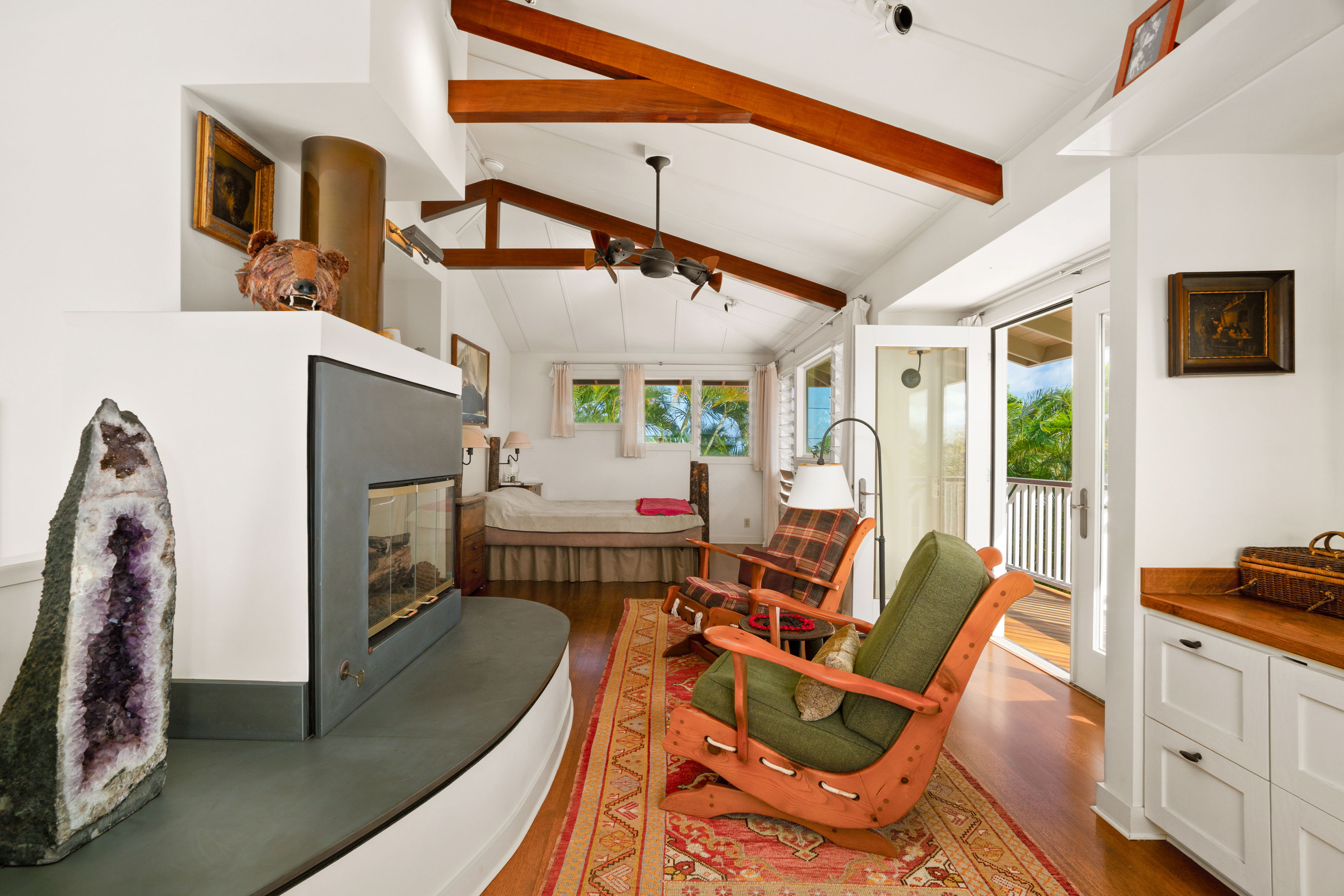 5225 Ua Road Kapaa, HI 96746 - Photo 24 of 30 a living room with furniture a flat screen tv and a refrigerator