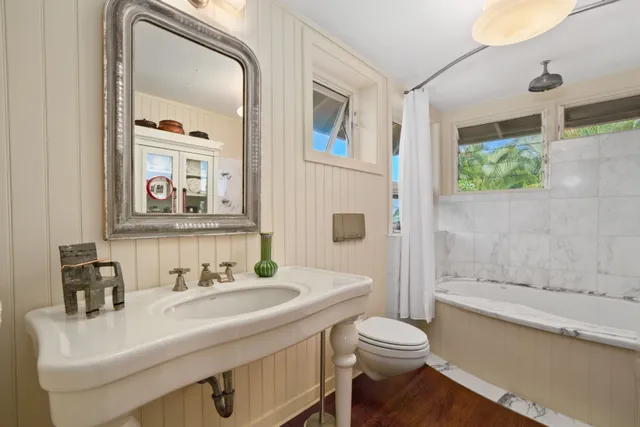 a view of balcony with wooden floor and seating space