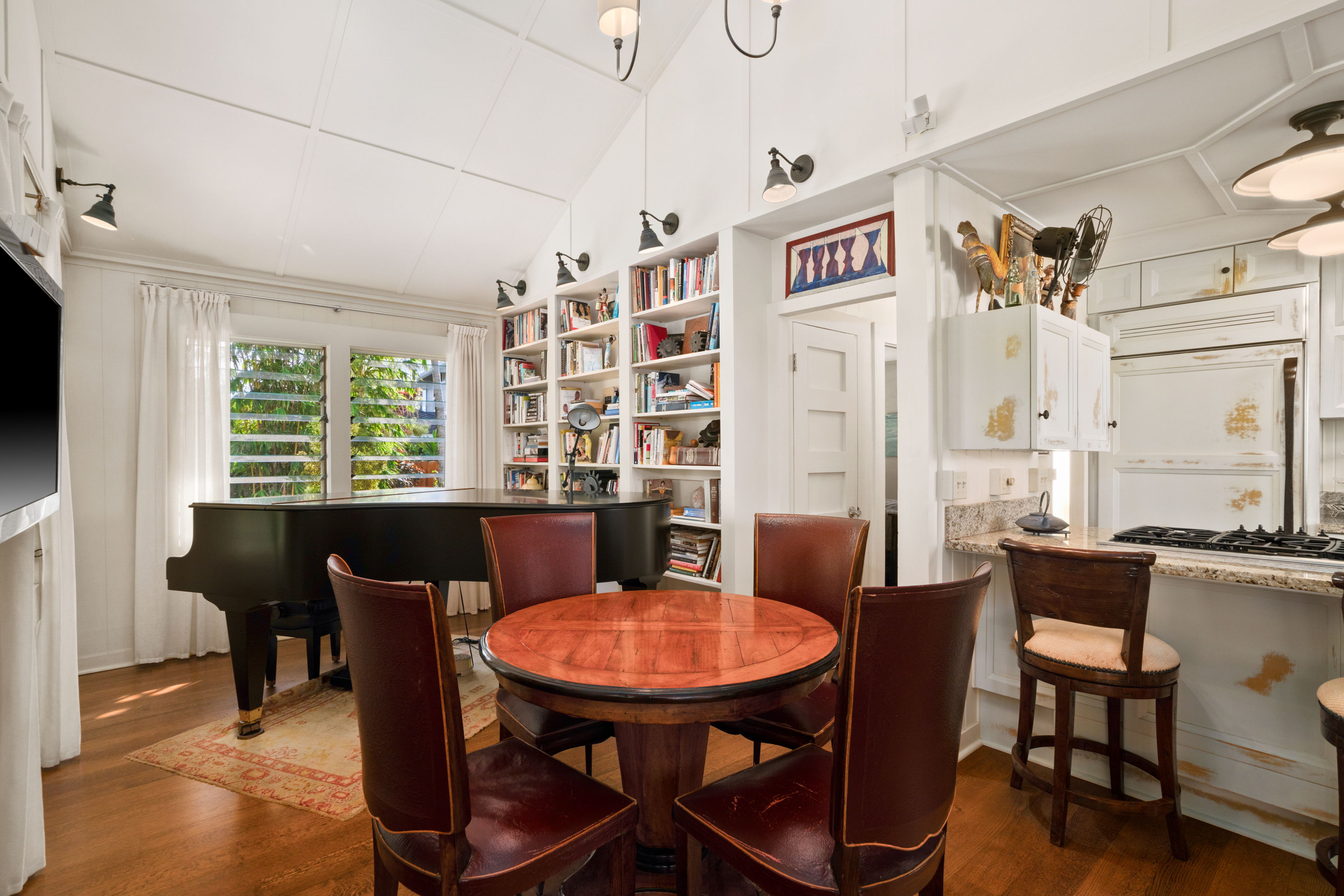 5225 Ua Road Kapaa, HI 96746 - Photo 10 of 30 a view of a dining room with furniture window and wooden floor