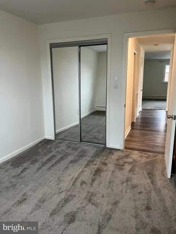 wooden floor and closet in a room
