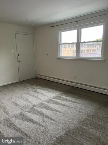 a view of a room that has a window in it
