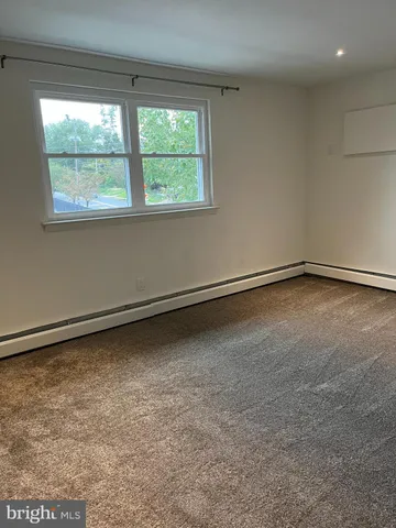 a view of a room with a large window