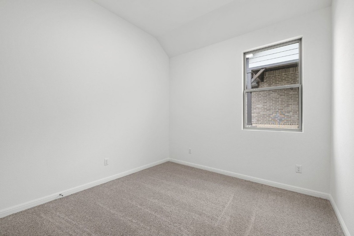 1249 Minorca Street Huffman, TX 77336 - Photo 17 of 25 an empty room with a window