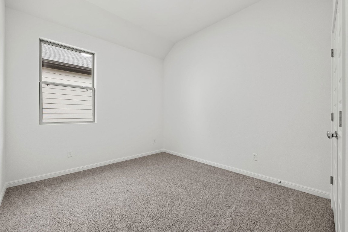 1249 Minorca Street Huffman, TX 77336 - Photo 19 of 25 an empty room with a window