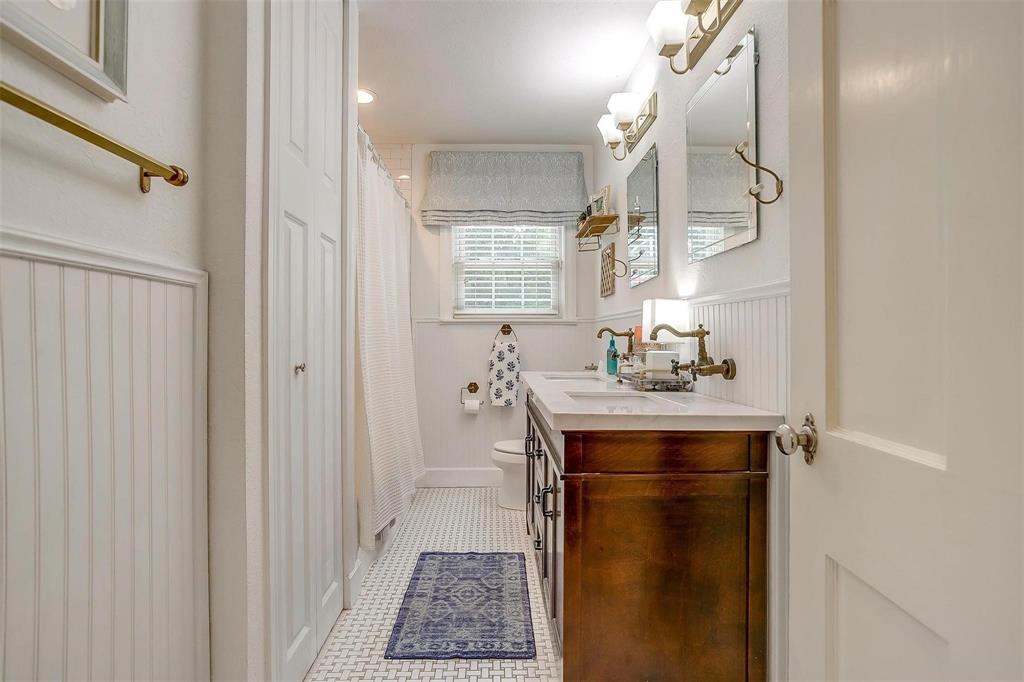 3616 Hilltop Road Fort Worth, TX 76109 - Photo 19 of 39 a bathroom with a sink and a mirror