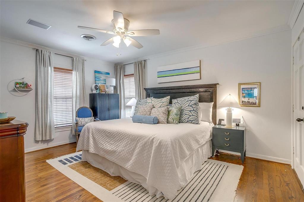 3616 Hilltop Road Fort Worth, TX 76109 - Photo 21 of 39 a bedroom with a large bed and a chandelier