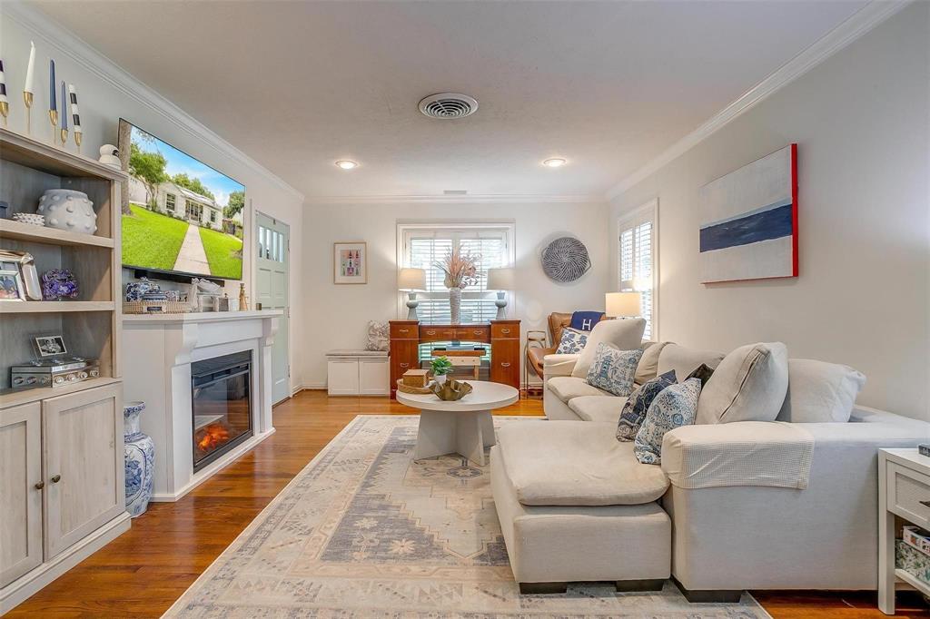 3616 Hilltop Road Fort Worth, TX 76109 - Photo 7 of 39 a living room with fireplace furniture and a flat screen tv