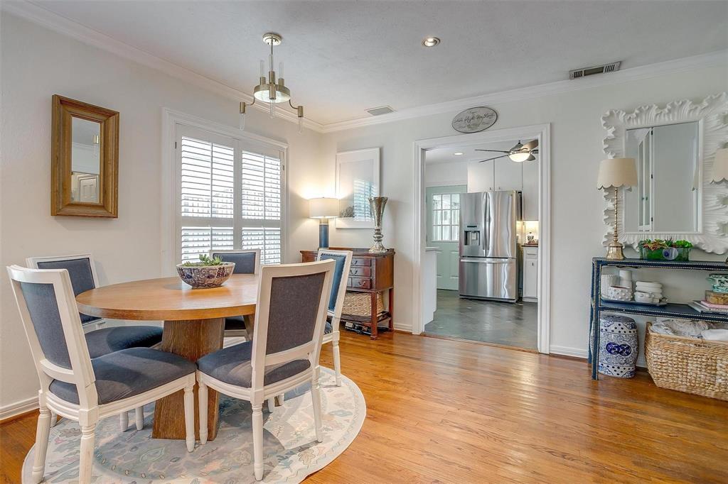 3616 Hilltop Road Fort Worth, TX 76109 - Photo 9 of 39 a view of a dining room with furniture and wooden floor