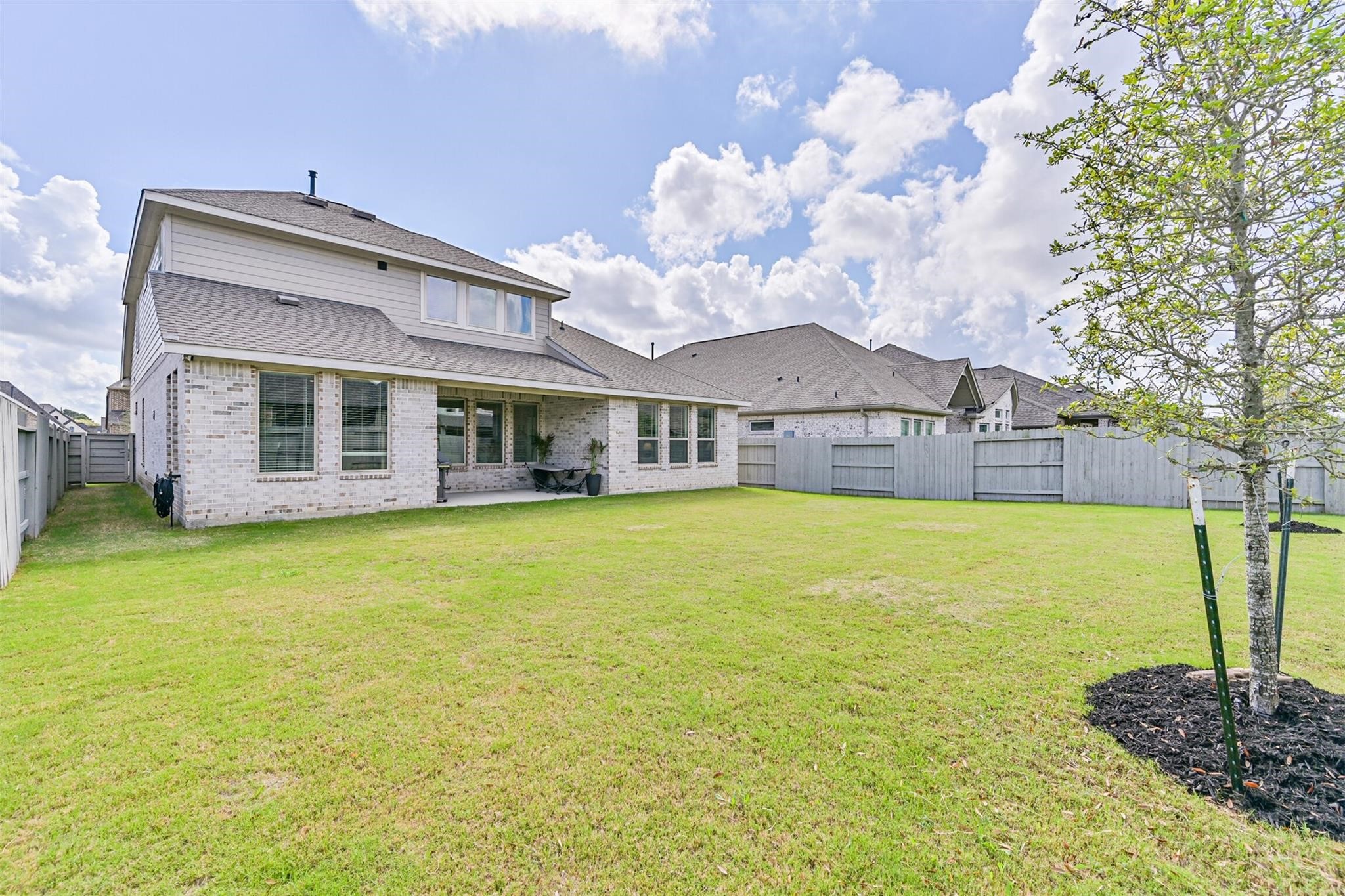 5010 Walnut Grv Lane Manvel, TX 77578 - Photo 46 of 46 a front view of a house with a large tree and a yard