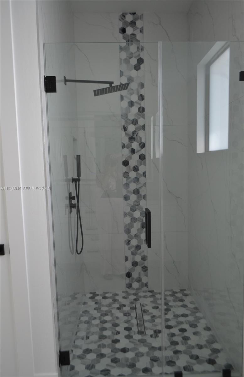 1116 Eight Street Lehigh Acres, FL 33972 - Photo 11 of 20 a bathroom with a shower