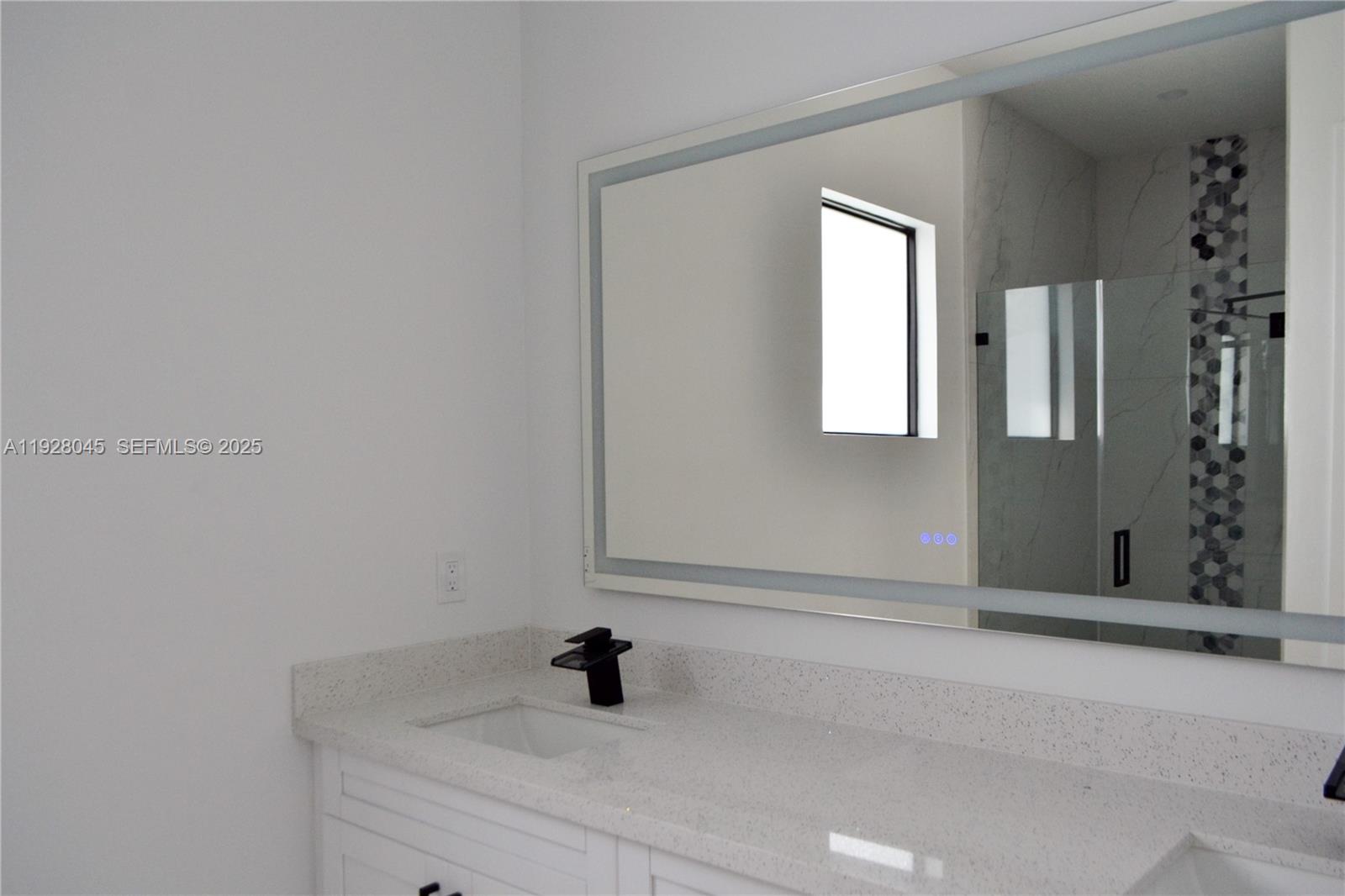 1116 Eight Street Lehigh Acres, FL 33972 - Photo 13 of 20 a bathroom with a sink and a mirror