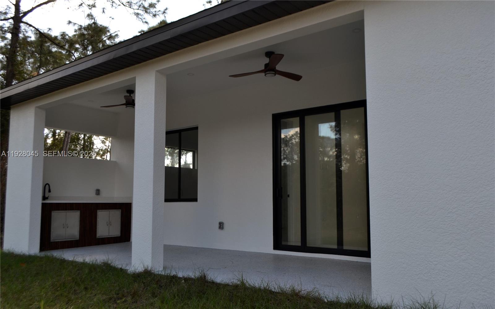 1116 Eight Street Lehigh Acres, FL 33972 - Photo 20 of 20 a view of a front door and porch