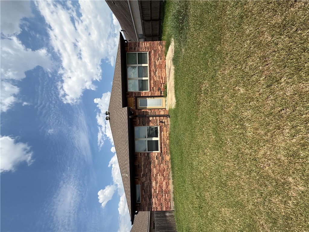 2208 Rindle Court Brenham, TX 77833 - Photo 18 of 22 a front view of house with yard