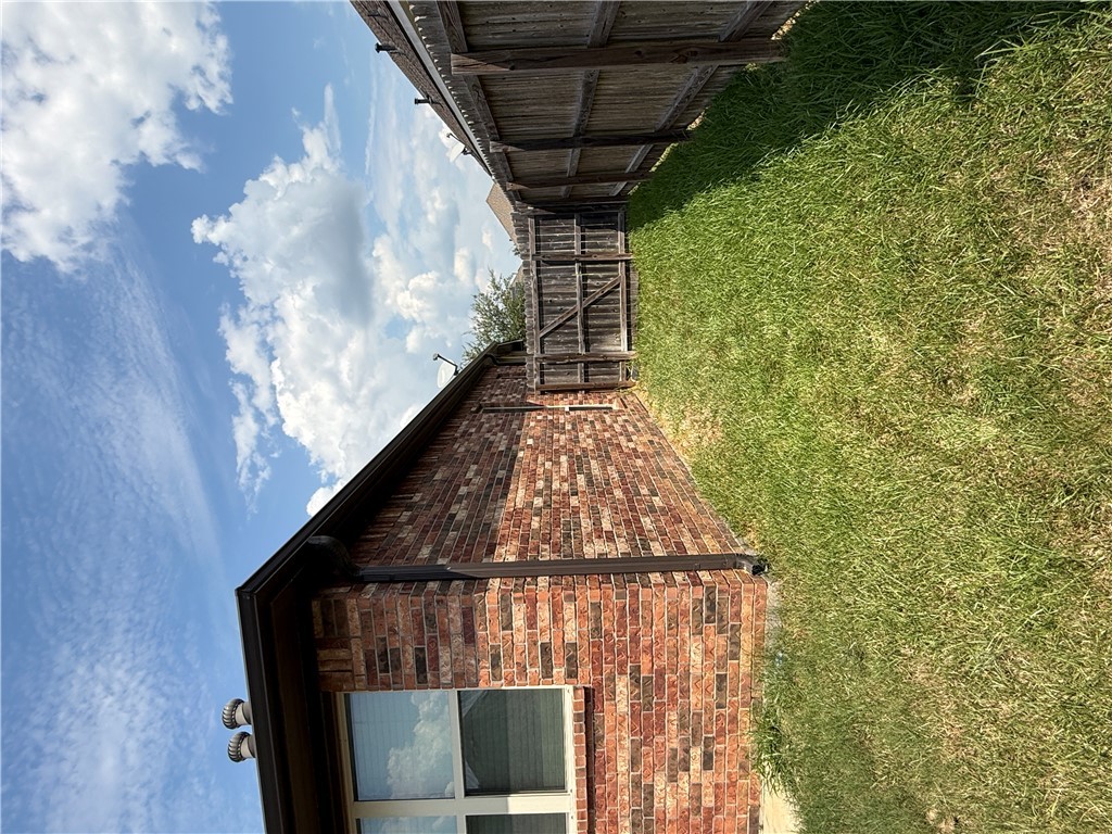 2208 Rindle Court Brenham, TX 77833 - Photo 22 of 22 a backyard of a house with lots of green space