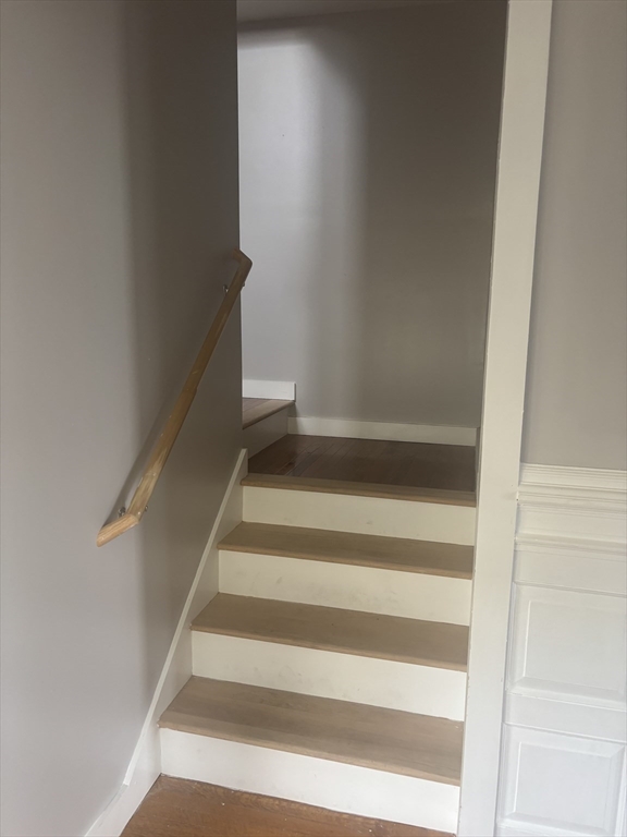 771 Rock Street Fall River, MA 02720 - Photo 12 of 31 a view of staircase with white walls and white door