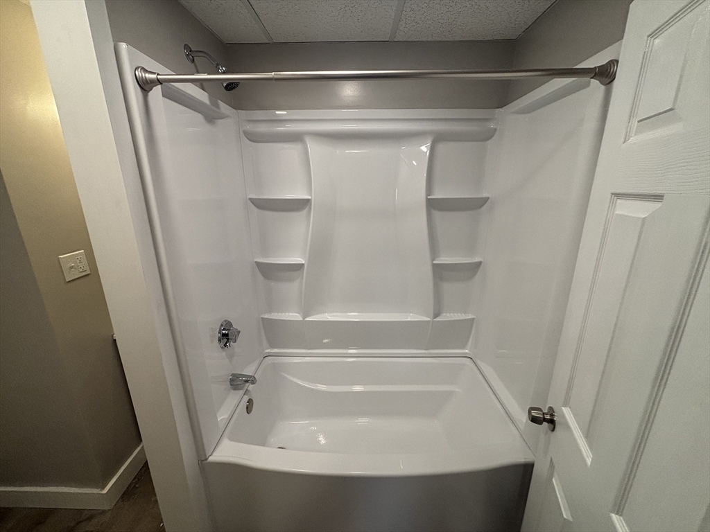771 Rock Street Fall River, MA 02720 - Photo 20 of 31 a bathroom with a tub and a shower