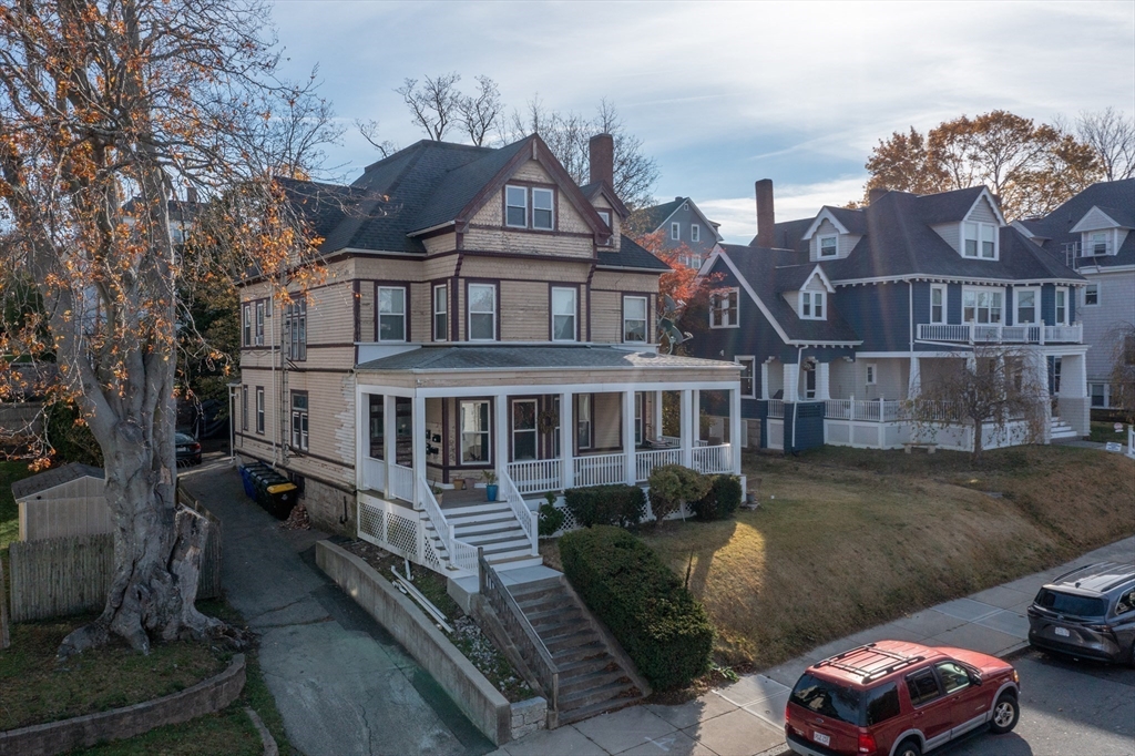 771 Rock Street Fall River, MA 02720 - Photo 2 of 31 a front view of a house with a garden