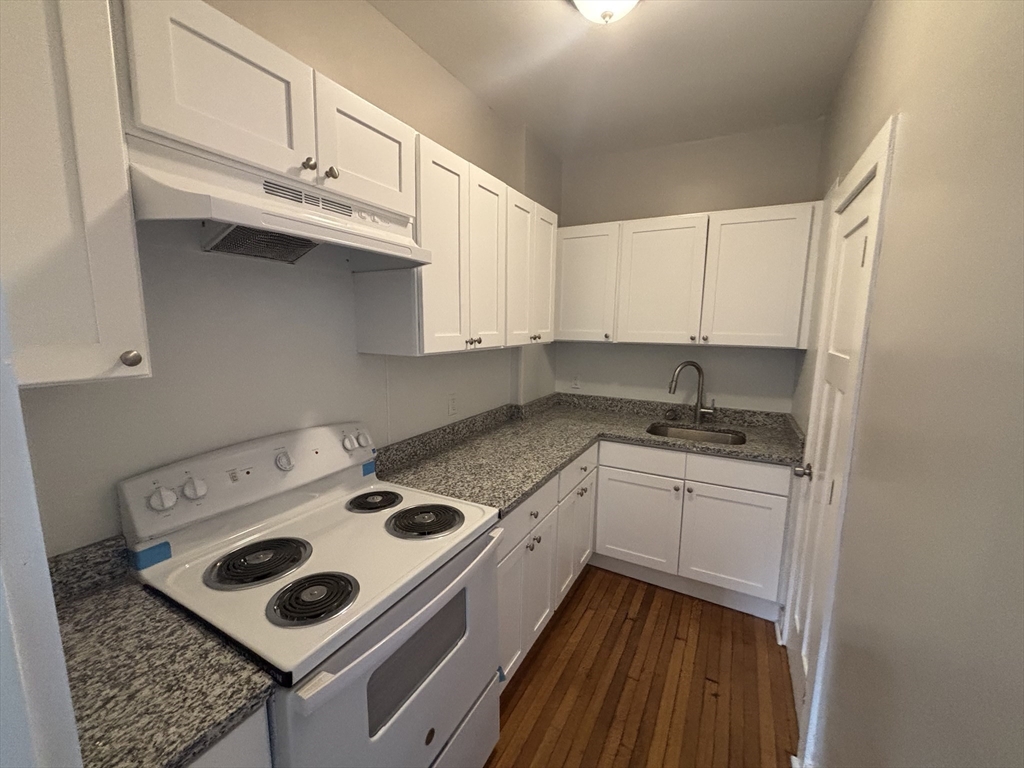 771 Rock Street Fall River, MA 02720 - Photo 25 of 31 a kitchen with appliances cabinets and a counter top space