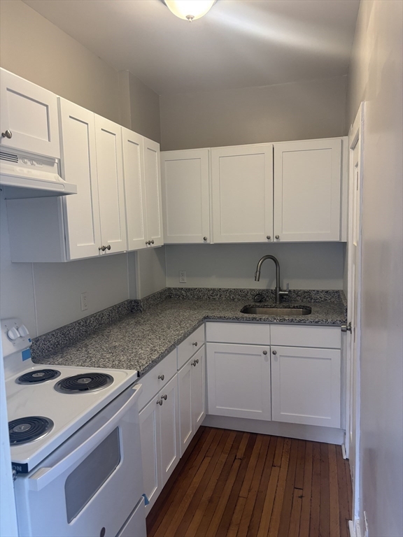 771 Rock Street Fall River, MA 02720 - Photo 27 of 31 a kitchen with granite countertop a sink stove and cabinets