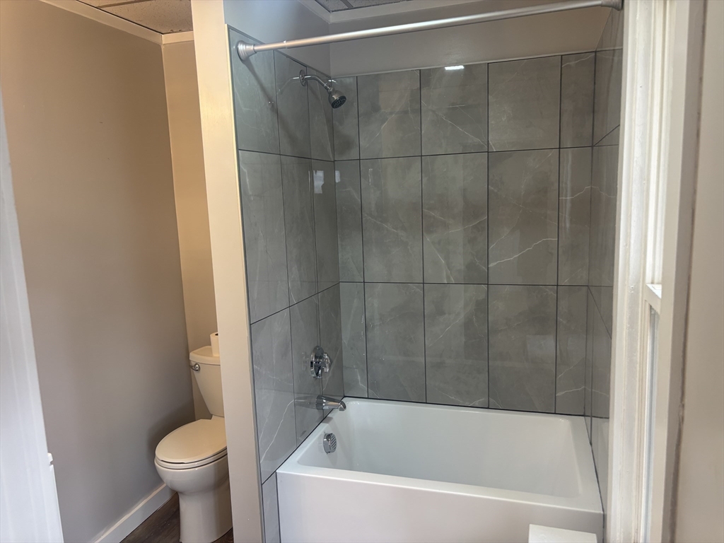 771 Rock Street Fall River, MA 02720 - Photo 30 of 31 a white bath tub sitting next to a toilet