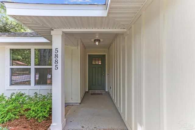 a view of a brick house with a large window