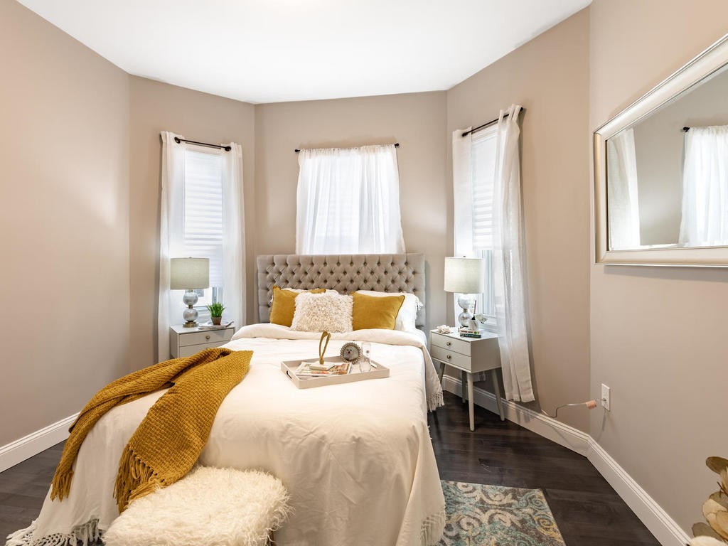 131 Congress Avenue, Unit 2 Chelsea, MA 02150 - Photo 13 of 30 a bedroom with a bed and wooden floor