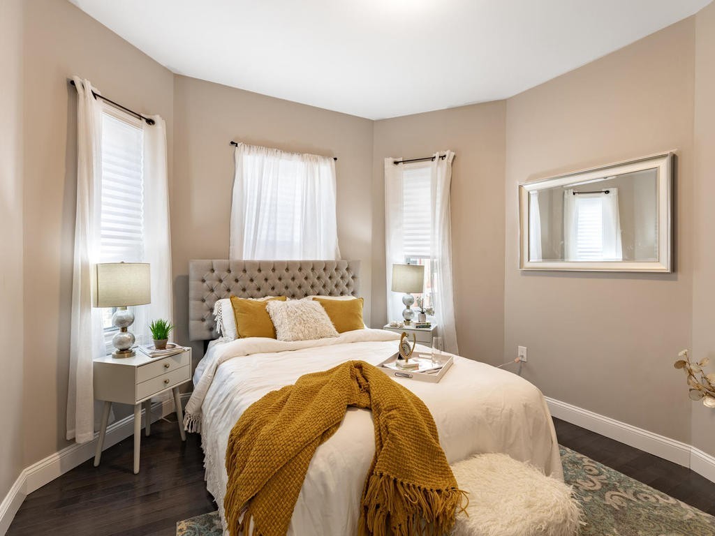 131 Congress Avenue, Unit 2 Chelsea, MA 02150 - Photo 14 of 30 a bedroom with a bed and window