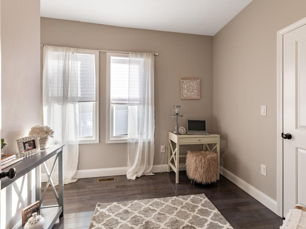 131 Congress Avenue, Unit 2 Chelsea, MA 02150 - Photo 17 of 30 a view of a bedroom with wooden floor and furniture