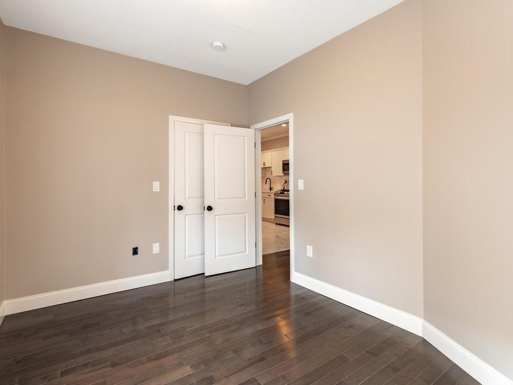 131 Congress Avenue, Unit 2 Chelsea, MA 02150 - Photo 20 of 30 an empty room with wooden floor