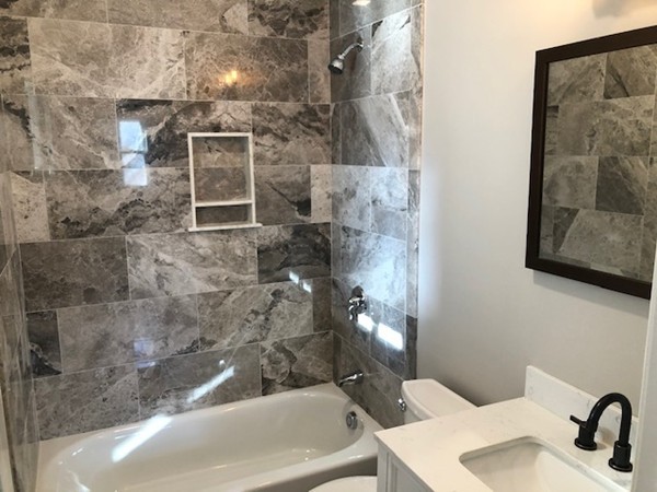 131 Congress Avenue, Unit 2 Chelsea, MA 02150 - Photo 21 of 30 a bathroom with a sink and mirror